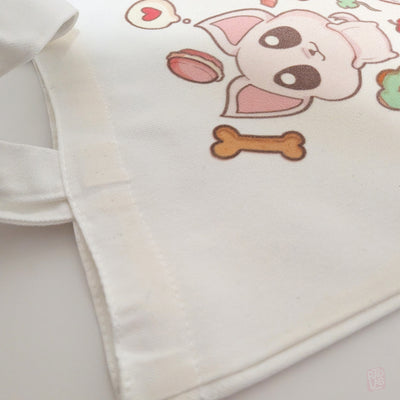 Close up Cute pastel tote bag featuring original Radlab characters surrounded by sweets, flowers, snacks, and kawaii café-themed artwork. Reusable 14 x 16 inch canvas polyester tote bag for everyday use.