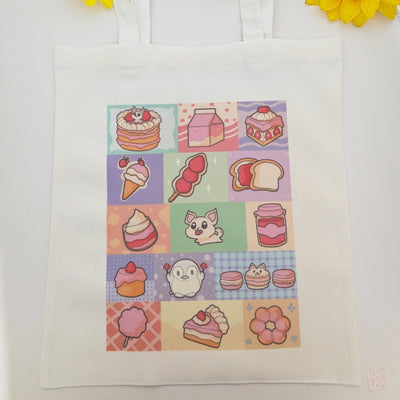 Cute pastel dessert-themed tote bag featuring original Radlab characters  surrounded by cakes, macarons, ice cream, pastries, and café-inspired artwork. Reusable 14 x 16 inch canvas polyester tote bag for shopping, school, conventions, and everyday use.

