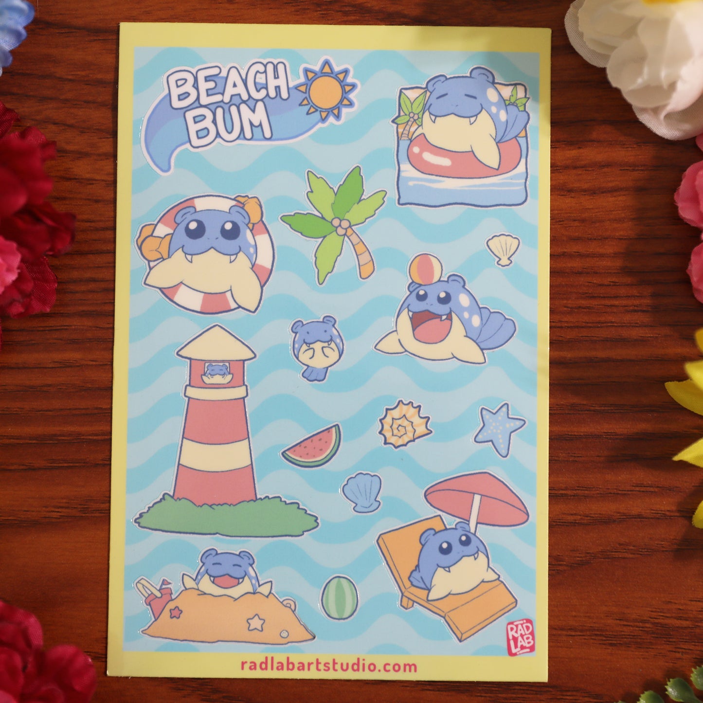 Pokemon sticker sheet with beach-themed designs on a wooden surface