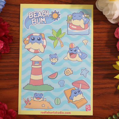 Pokemon sticker sheet with beach-themed designs on a wooden surface